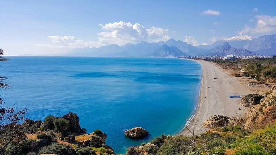 Antalya: A view taken from the cliffs towards Antalya Konyaaltı Beach in February 2018. The snowy part in the middle is the Bey Mountains and the sno